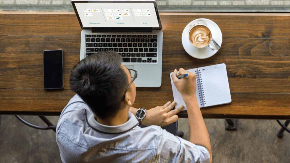 A person taking Duarte's Presentation Principles on-demand course while seated at a coffee shop.