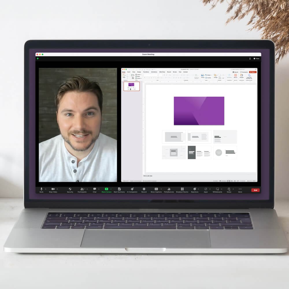 A laptop shows a person on a virtual call and a slide editing tool.