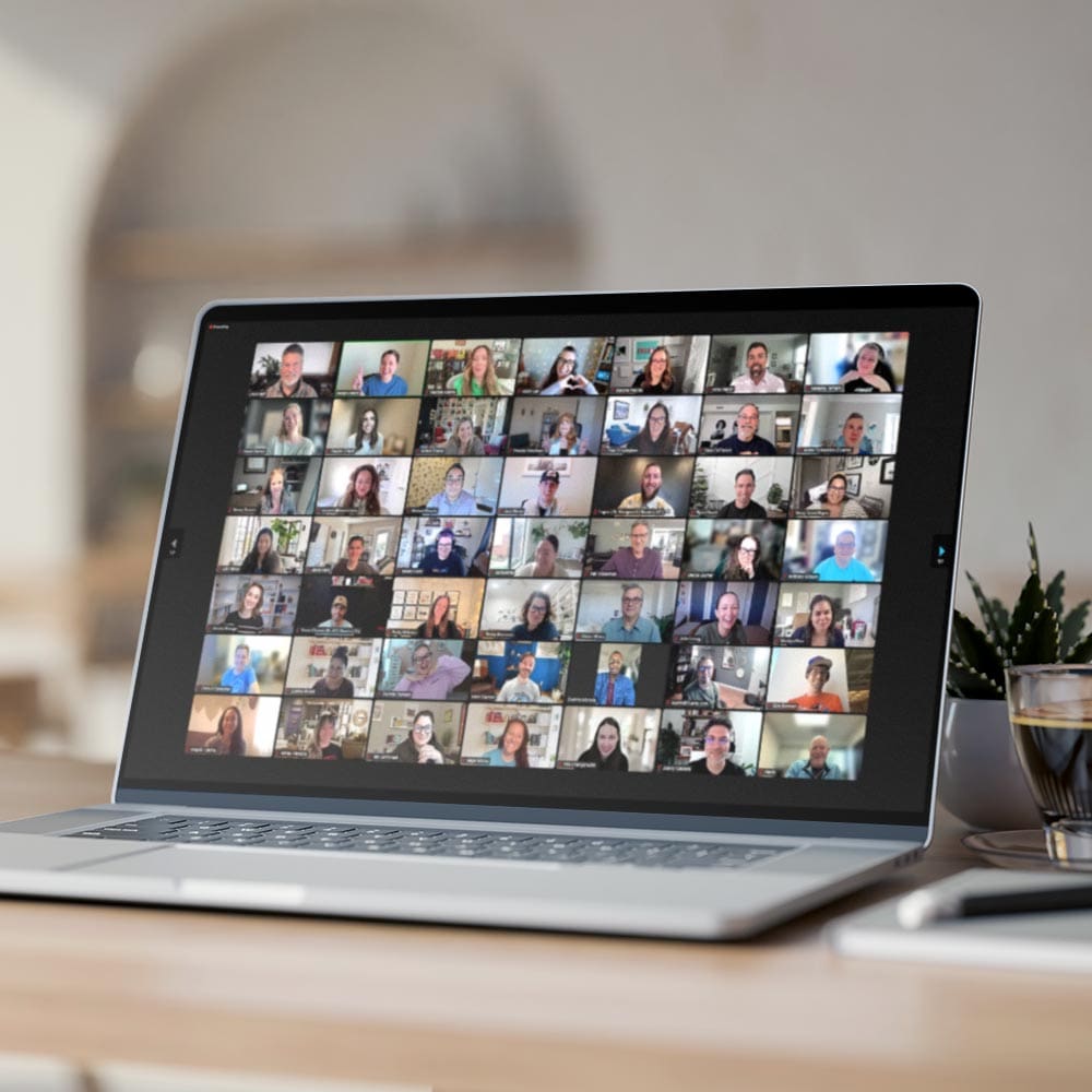 computer with employees faces on a zoom call