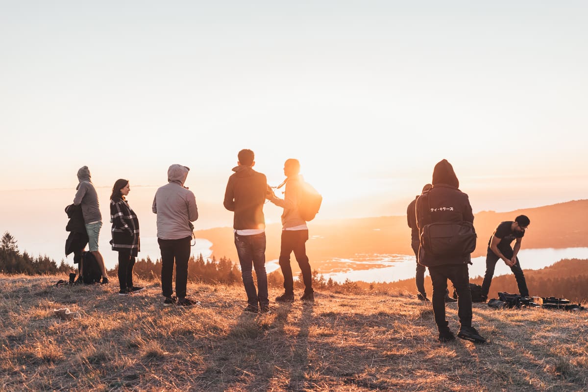 Photographers "Mighty Killers" prepare for an outdoor photoshoot with Duarte