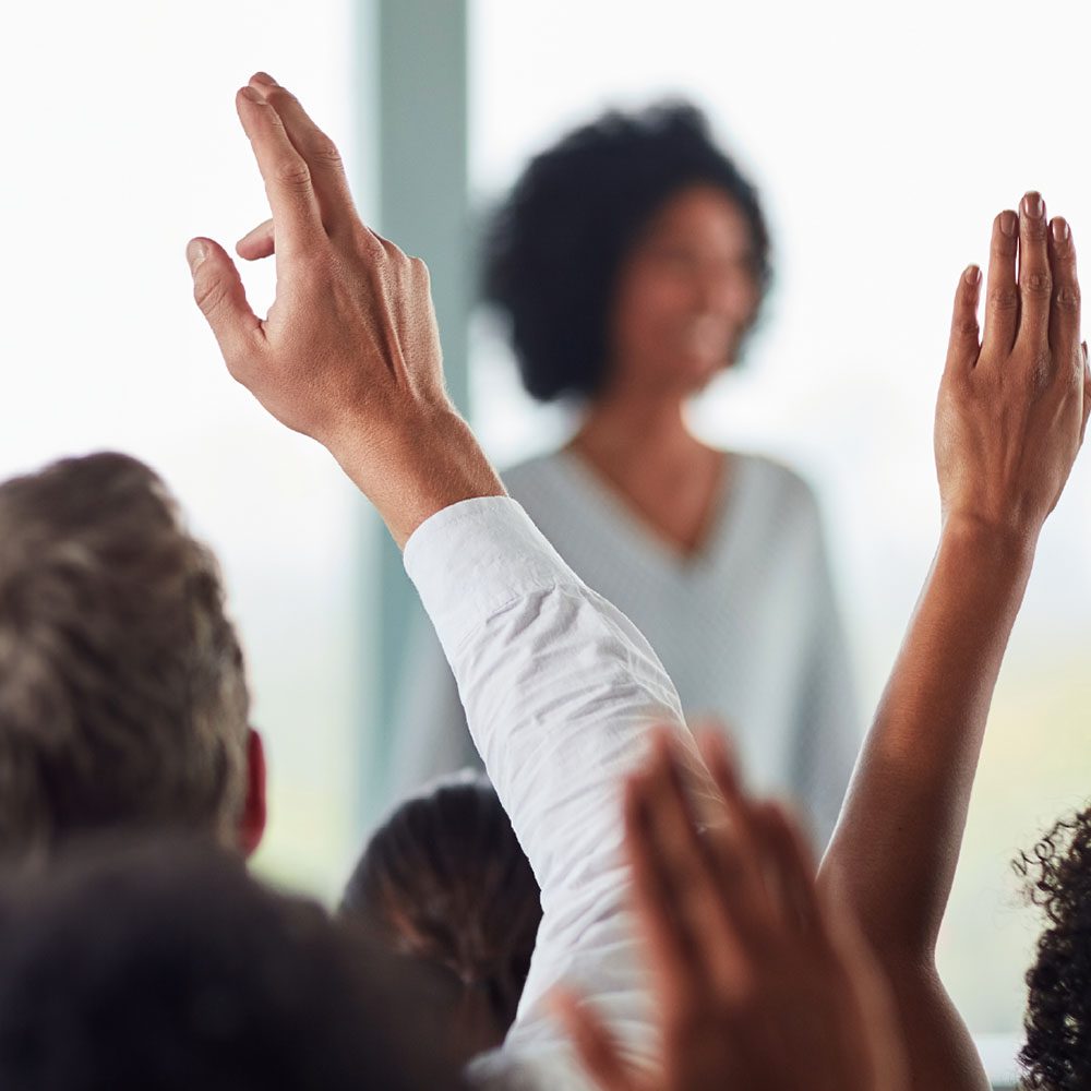 Hands raised with questions