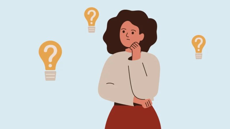 Image of a leader deep in thought considering how to approach a tough conversation with executive presence. They’re surrounded by light bulbs against a solid background.